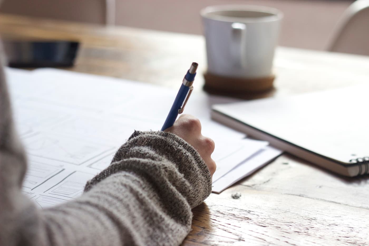 Student writing a descriptive examination answer