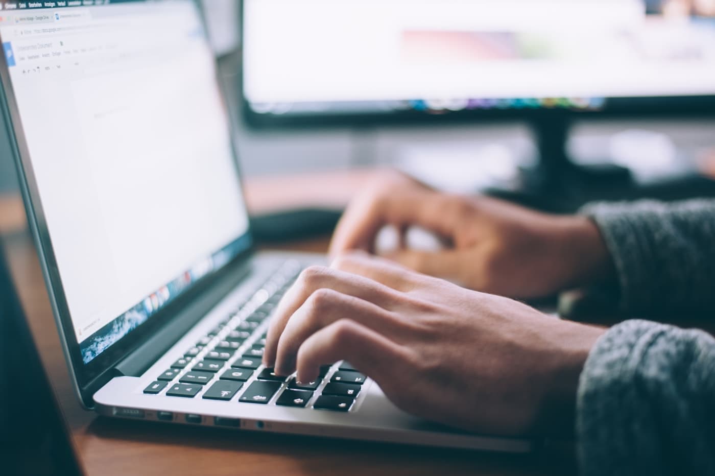 Examiner evaluating answer scripts remotely on a laptop